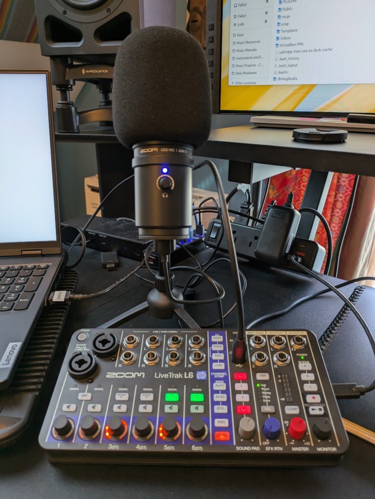 Zoom LiveTrak L6 on a messy desk